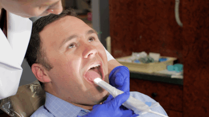 Animated gif of technician using MouthWatch camera
