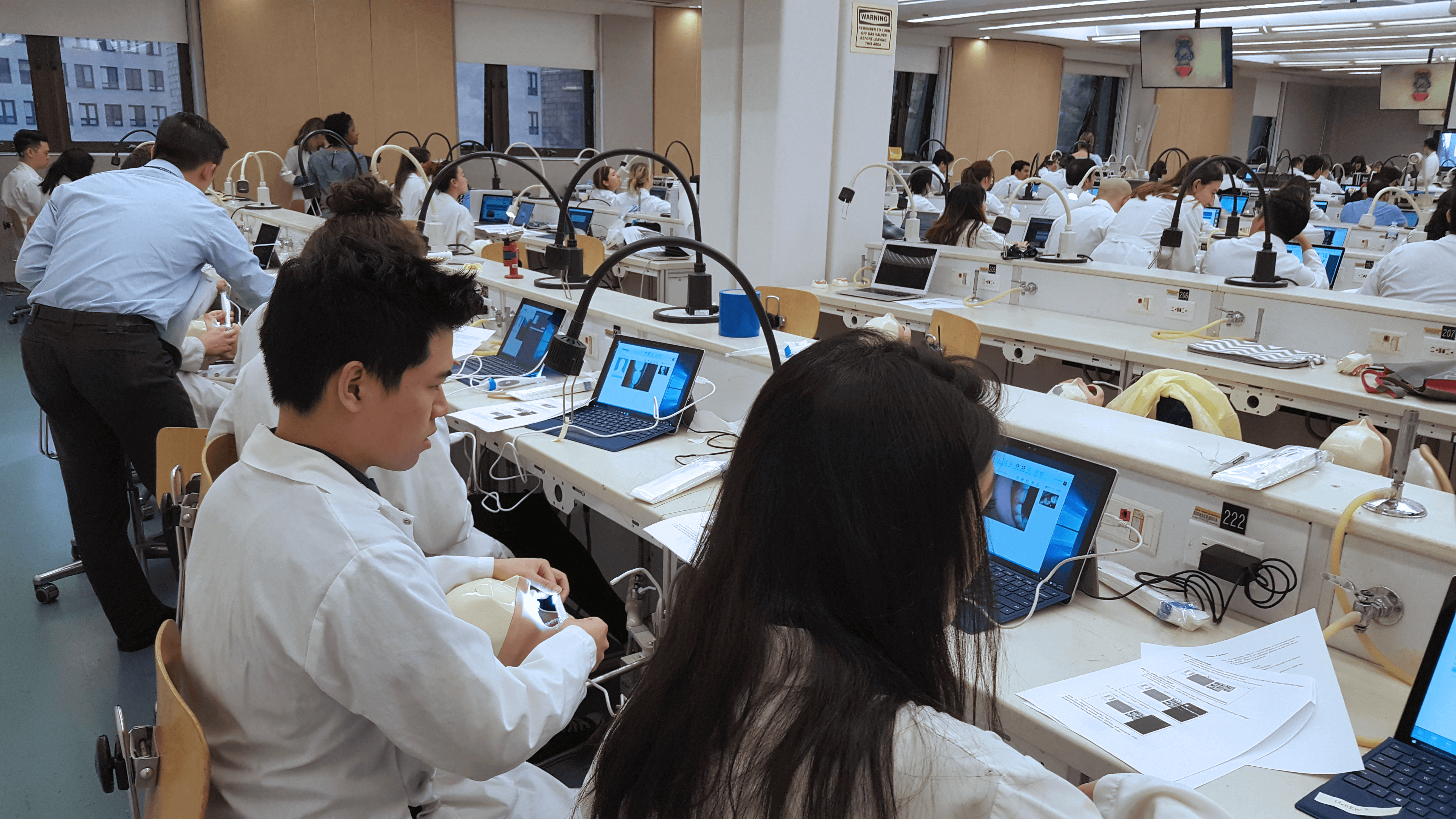 Dental students using MouthWatch intraoral cameras on typodonts